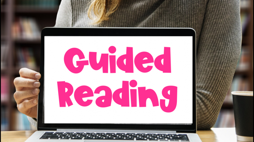 teacher, laptop on desk, guided reading