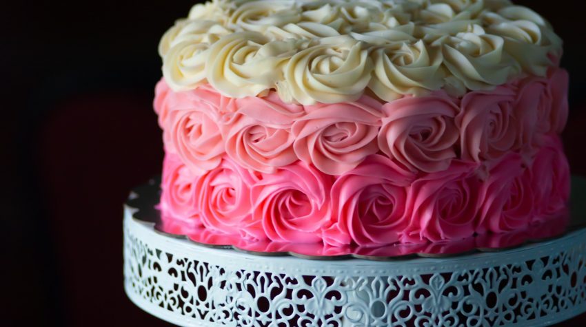 pink ombre cake on white stand for teaching phonics and comprehension by Conversations in Literacy